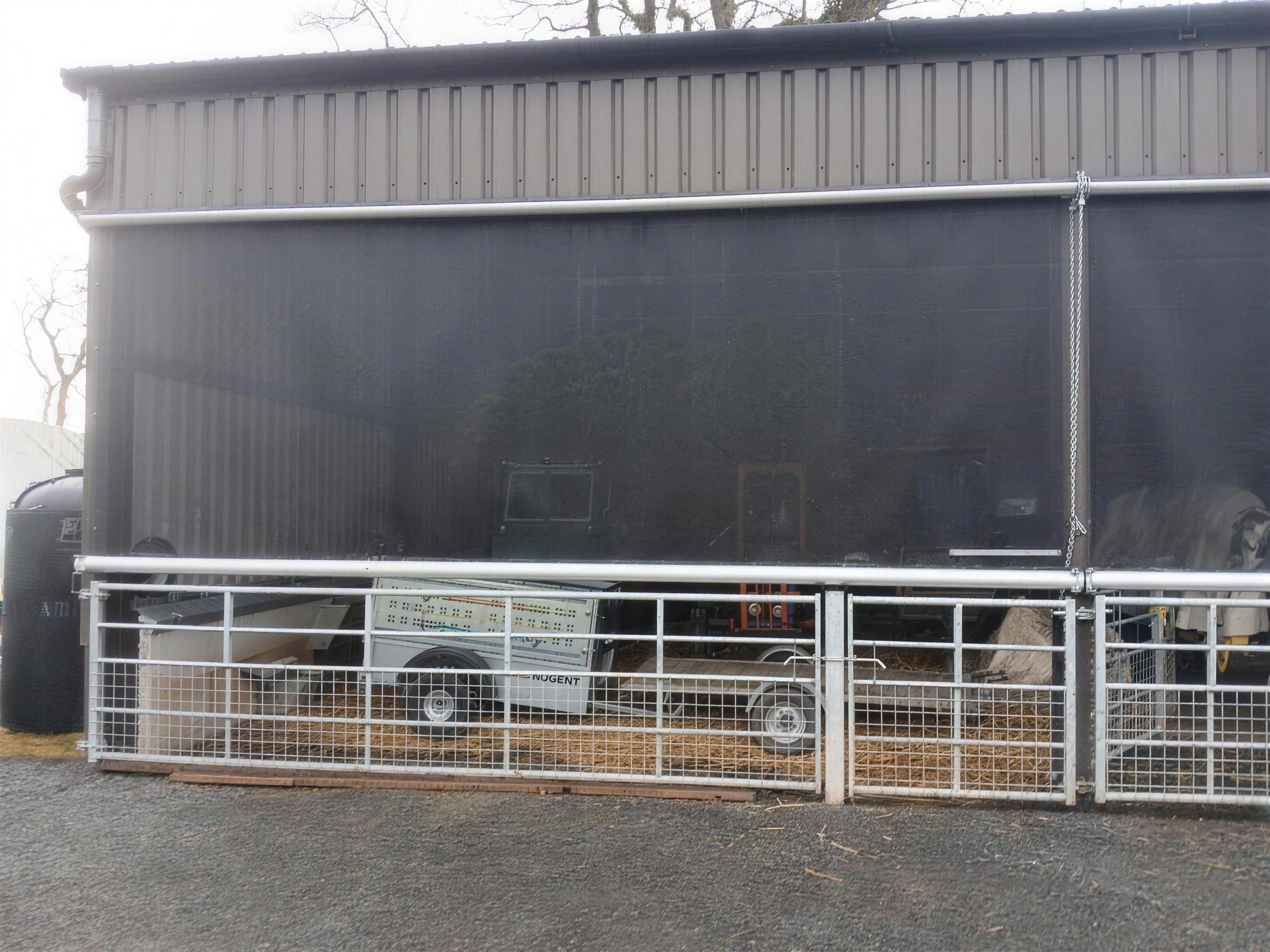 Hand chain roller blind on a farm building
